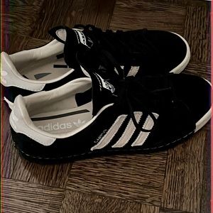 Black and beige Adidas campus shoes